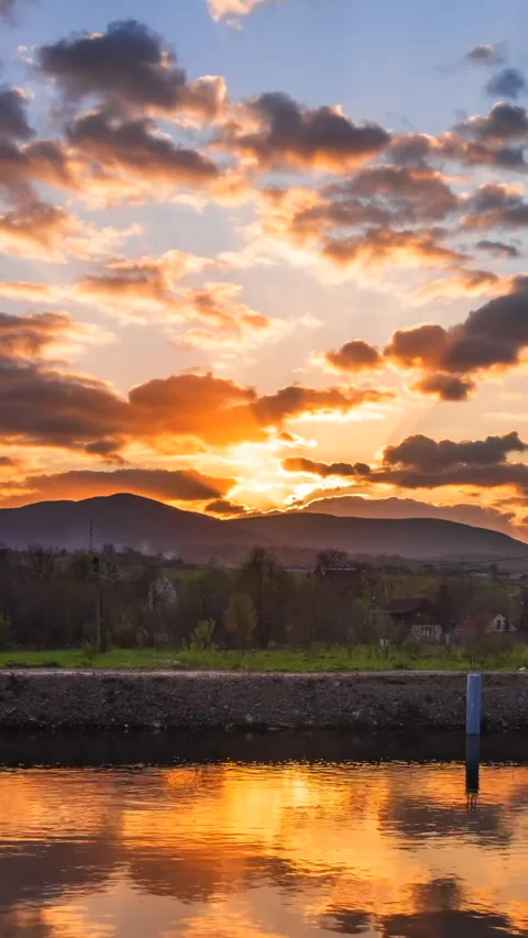 Colorful sunset in the cloudy sky time lapse Stock Footage 293157585