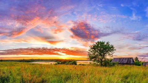 Colorful sunset in a countryside Stock Photos
