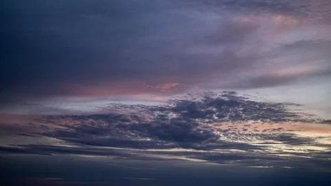 Colorful sunset with dramatic clouds over the horizon Stock Photos