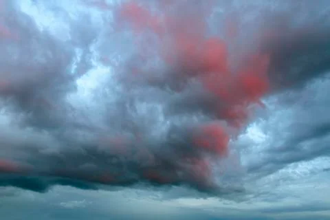Colorful sunset. Dramatic sky background with dark clouds. Stock Photos