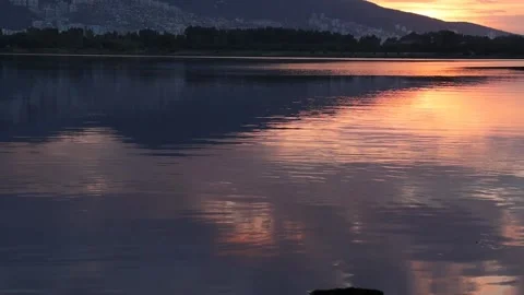 Colorful Sunset over the Lake with the reflection on the water Stock Footage 265584496