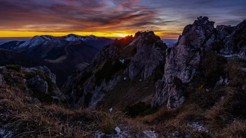 Colorful Sunset with Red Clouds over Alps Mountains in Early Winter, Time Lapse Stock Footage 320994658