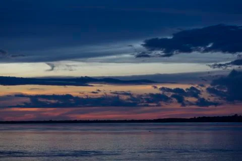 Colorful sunset on the river Amazon in the rainforest, Brazil Stock Photos