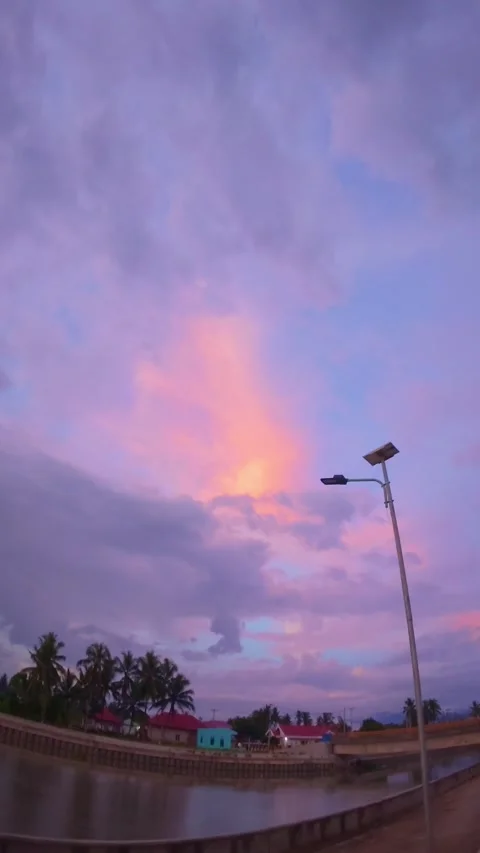 Colorful Sunset Sky with Clouds and Waterfront Stock Footage 310868917
