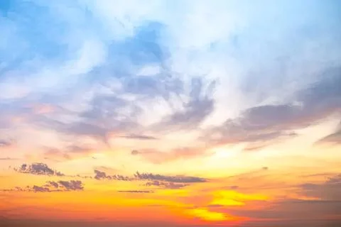 Colorful sunset sky with clouds in the evening Stock Photos