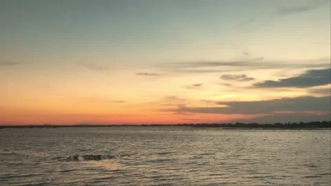 Colorful Sunset Sky Gradient Over Calm Lake Water In Rural Cambodia Stock Footage 341647824