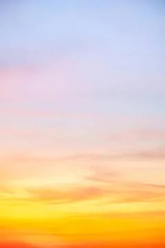 Colorful sunset sky with soft clouds at dusk Stock Photos