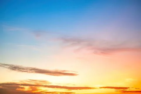 Colorful sunset sky with soft clouds over horizon Stock Photos