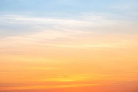 Colorful sunset sky with soft clouds over horizon Stock Photos