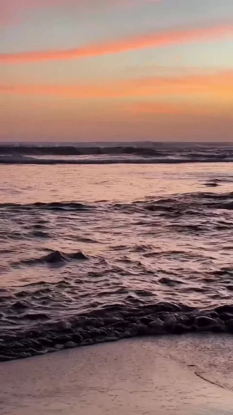 Colorful Sunset Waves Rolling Onto Tropical Beach Shore Stock Footage 337466405