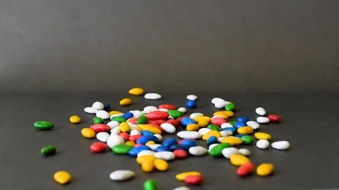 Colorful sweets on a black table background Stock Footage 94758292