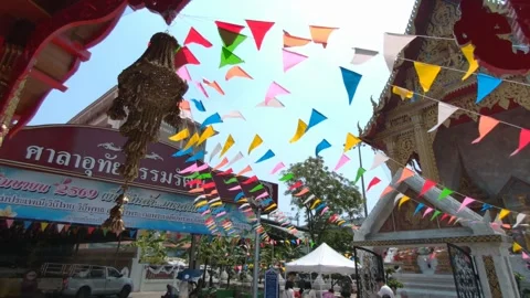 Colorful Temple Flags Waving in Wind During Songkran Festival at Wat Samian Nari 스톡 동영상 333035907