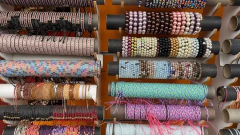 Colorful textile threads organized on spools in a variety of patterns and c.. Stock Footage 331714628