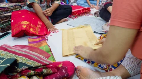 Colorful Textiles and Fabrics Sorting activities in shop Stock Footage 311633001
