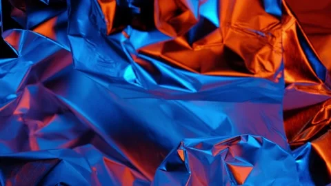 Colorful texture of foil in changing red and blue lights. abstract background Stock Footage 147749591