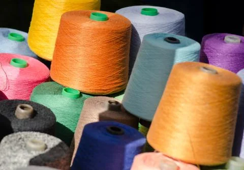 Colorful thread spools as background. Stock Photos