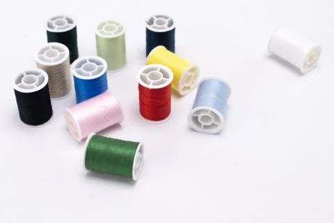 Colorful Thread Spools on White Background - Sewing and Craft Supplies Stil.. Stock Photos
