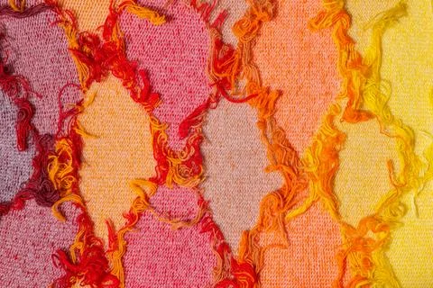 Colorful threads. Argyle pattern. Warm colors. Red shades background Stock Photos