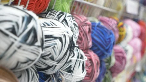 Colorful threads. Knitting pattern of colorful yarn wool on shopfront. Knitting Stock Footage 95422640