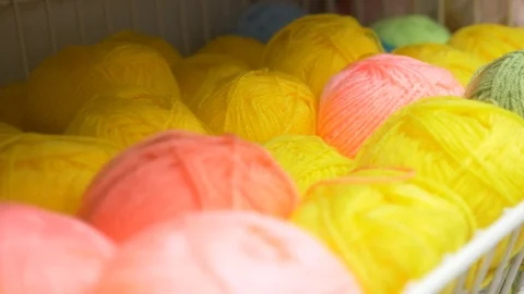 Colorful threads. Knitting pattern of colorful yarn wool on shopfront. Knitting Stock Footage 95422695