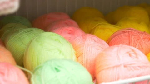 Colorful threads. Knitting pattern of colorful yarn wool on shopfront. Knitting Stock Footage 95422725