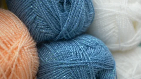 Colorful threads. Knitting pattern of colorful yarn wool on shopfront. Knitting Stock Footage 95422807
