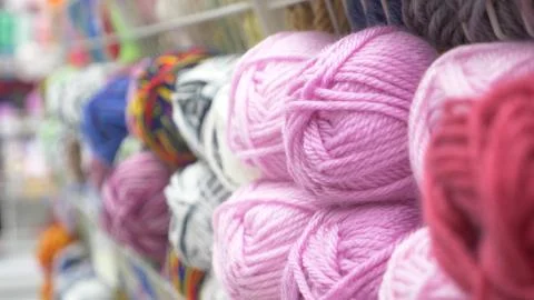 Colorful threads. Knitting pattern of colorful yarn wool on shopfront. Knitting Stock Photos