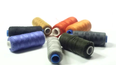 Colorful threads rotate on a white background Video stock 151864744