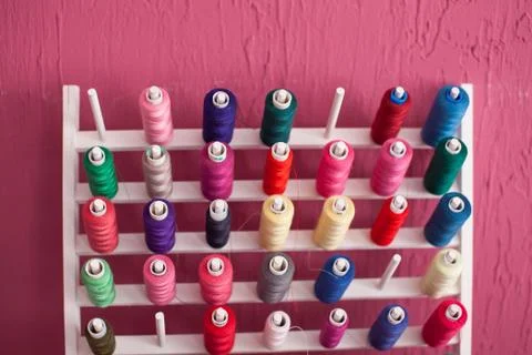 Colorful threads on a shelf at a sewing workshop, Stock Photos