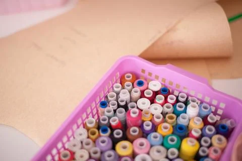 Colorful threads on a shelf at a sewing workshop, Stock Photos