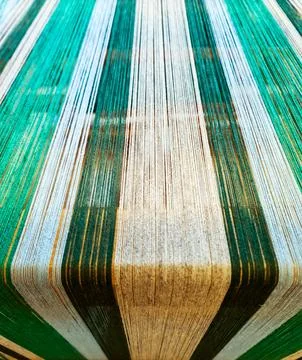 Colorful threads stretching creating fabric background Stock Photos