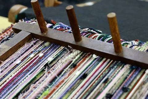 Colorful threads in the weaving machine Fotos de archivo