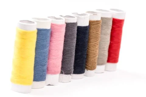 Colorful threads on the white background Stock Photos