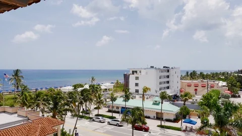 Colorful Timelapse of Clouds passing over a road with vehicles near the Ocean Stock Footage 95493160