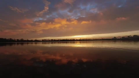 Colorful timelapse of a red sunset over a lake, privacy in nature. Stock Footage 224545425
