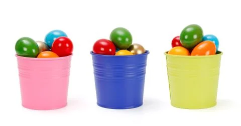 Colorful tin pails with easter eggs Stock Photos
