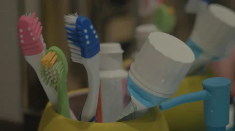 Colorful toothbrushes in a mug Stock Footage 43224963