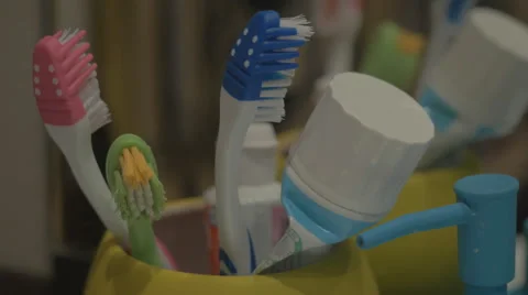 Colorful toothbrushes in a mug Stock Footage 43225117