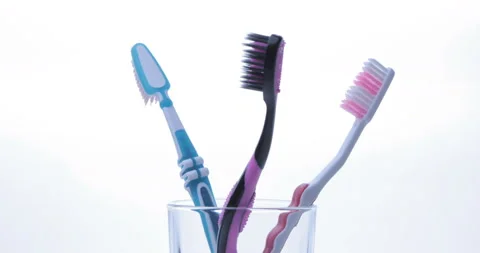 Colorful toothbrushes rotating. Close up Stock Footage 131000149