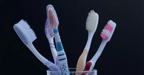 Colorful toothbrushes rotating. Close up Stock Footage 131001629