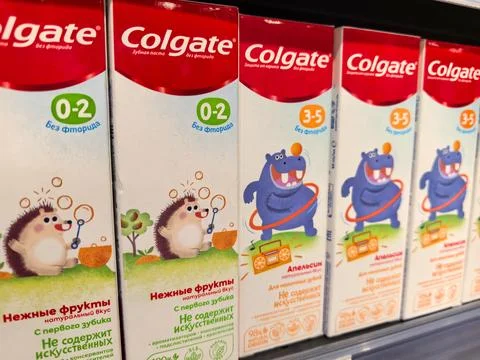 Colorful toothpaste boxes for children displayed on a retail shelf Stock Photos