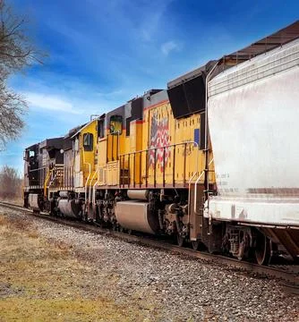Colorful Train Engine  set pulling Freight to Detroit Railyard Stock Photos