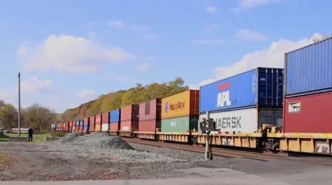 Colorful Train Rolling Through Town Stock Footage 43785514