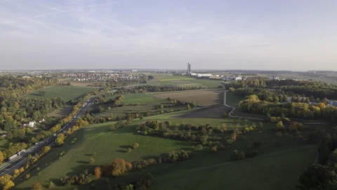 Colorful trees and meadows along highway and a tower in autumn aerial time lapse Stock Footage 221363690
