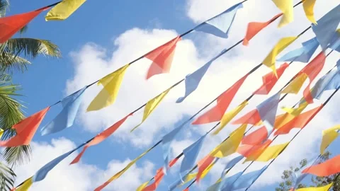 Colorful triangle bunting flags or banderitas hanging against blue sky. Stock Footage 271610320