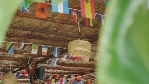 Colorful triangle flags blowing in the wind at a beach cafe. flags of different Stock-Footage 127149894