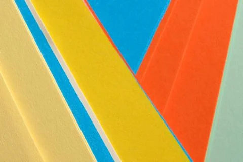 Colorful triangles form a geometric pattern on a surface 스톡 사진