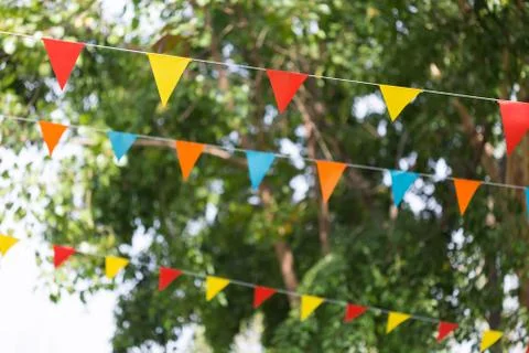 Colorful triangular flags of decorated celebrate outdoor party Stock Photos