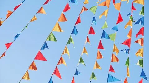 Colorful triangular flags waving in the wind in Moscow Stock Photos
