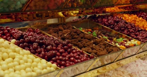 Colorful Turkish delight candies displayed in shop window bins Stock Footage 339631353